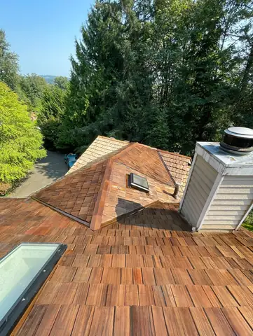 Cedar shake roof work with skylight